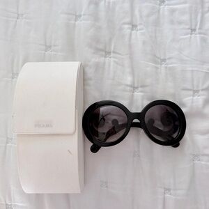 Authentic Prada Women’s Black Round Sunglasses with Dark Lenses